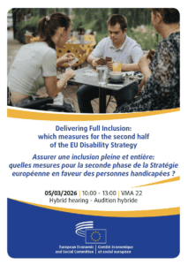 Three people sit at a table in discussion with a laptop, documents, and coffee cups, at an event on the EU Disability Strategy scheduled for 5 March 2026.