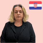 A woman with shoulder-length blonde hair wearing a black top and blazer stands in front of a light pink background with a Croatian flag in the top right-hand corner.
